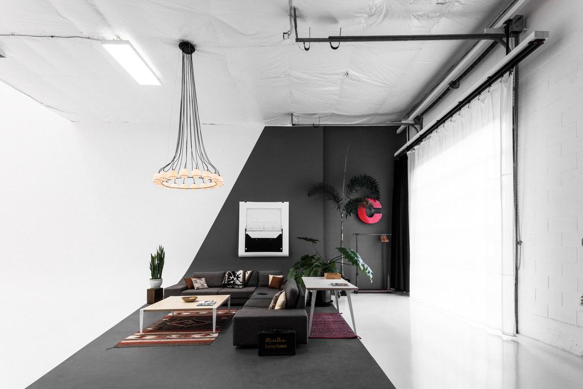 Worktable and lounge under the window's sheer curtain