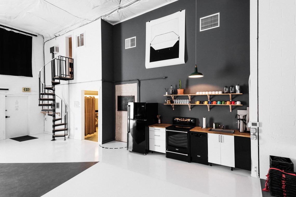 Spiral staircase beside the kitchenette